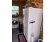 Utility room with modern washer, dryer, and additional refrigerator for convenience at 417 Via Veneto, Venice, FL 34285