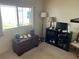 Comfortable living room with a window and decorative storage chest with furnishings at 417 Via Veneto, Venice, FL 34285