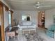 Relaxing living room featuring a comfortable white sofa and view of the water at 417 Via Veneto, Venice, FL 34285