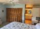 View from the bedroom showing the spacious closet and a glimpse of the bathroom at 417 Via Veneto, Venice, FL 34285