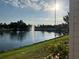 Serene view of the community pond with a fountain feature, offering a peaceful atmosphere at 417 Via Veneto, Venice, FL 34285