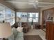Relaxing sun room with bright lighting, comfortable seating, and sunny water views at 417 Via Veneto, Venice, FL 34285