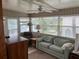 Relaxing sun room with comfortable seating, bright windows, and water views at 417 Via Veneto, Venice, FL 34285