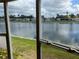 Screened in porch view with serene water and lush green landscape at 417 Via Veneto, Venice, FL 34285