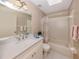 Bathroom with a single vanity, a bathtub with shower, and neutral finishes at 4270 Ascot Dr, North Port, FL 34291