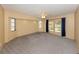 Carpeted living room featuring French doors and multiple windows for natural light at 4270 Ascot Dr, North Port, FL 34291