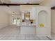 Spacious living room featuring tile flooring, white walls, and natural light with open access to the kitchen at 4270 Ascot Dr, North Port, FL 34291