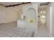 Spacious living room featuring tile flooring, white walls, and natural light with open access to the kitchen at 4270 Ascot Dr, North Port, FL 34291