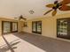 Covered patio has multiple ceiling fans and glass doors for indoor-outdoor living at 4270 Ascot Dr, North Port, FL 34291