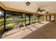 Spacious screened-in porch offers peaceful views of the landscaped backyard at 4270 Ascot Dr, North Port, FL 34291