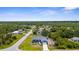 An aerial view shows the property's location in a neighborhood with tree coverage at 4305 Heyward St, North Port, FL 34291
