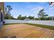 A backyard with a spacious, newly constructed wooden deck, offering a great outdoor living space at 4305 Heyward St, North Port, FL 34291