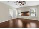 Bedroom featuring dark wood floors, a ceiling fan and natural light coming through window blinds at 4305 Heyward St, North Port, FL 34291