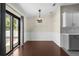 An empty dining area with a sliding glass door and wood-look flooring at 4305 Heyward St, North Port, FL 34291