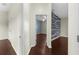 Hallway view leading into a bedroom with an accent wall at 4305 Heyward St, North Port, FL 34291