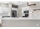 Bright kitchen features white countertops and cabinets plus stainless steel appliances at 4305 Heyward St, North Port, FL 34291