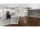 Modern kitchen featuring white cabinets, stainless steel appliances, and a breakfast bar at 4305 Heyward St, North Port, FL 34291