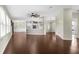 Open living space with hardwood floors that connects to the kitchen and entryway at 4305 Heyward St, North Port, FL 34291