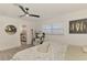 A naturally lit bedroom shows open view of the patterned bathroom, along with decor and plants at 4321 Shamrock Dr, Venice, FL 34293