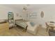 Comfortable bedroom featuring natural light and stylish decorative design, and wooden flooring at 4321 Shamrock Dr, Venice, FL 34293