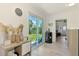 Welcoming entryway featuring sliding glass doors leading to a lush backyard and bright natural light at 4321 Shamrock Dr, Venice, FL 34293