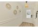 Bright foyer features stylish mirrors and a pendant light fixture that complements the front door at 4321 Shamrock Dr, Venice, FL 34293