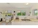 Bright kitchen with a double sink, and natural light streaming through the windows overlooking the green outdoors at 4321 Shamrock Dr, Venice, FL 34293
