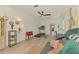 Relaxing living room featuring a ceiling fan, home gym, and open floor plan at 4321 Shamrock Dr, Venice, FL 34293