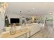 Bright living room features plank floors, a TV, and a comfortable seating arrangement that is perfect for relaxing at 4321 Shamrock Dr, Venice, FL 34293