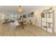 Open-concept living space with modern accents and plenty of natural light, with a comfortable dining area at 4321 Shamrock Dr, Venice, FL 34293