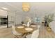 Bright and airy living space with modern furnishings, dining area, and a modern kitchen, perfect for gatherings at 4321 Shamrock Dr, Venice, FL 34293