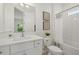 Well-lit bathroom with a single vanity, tub, shower, and stylish decor at 4390 Asteria Ter, North Port, FL 34287