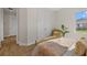 Serene bedroom featuring a large window, closet and views of the outdoor scenery at 4390 Asteria Ter, North Port, FL 34287