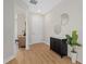 Inviting entryway with sleek flooring, a stylish cabinet, and natural light at 4390 Asteria Ter, North Port, FL 34287