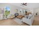 Open-concept living area with bright decor and modern furniture near the kitchen at 4390 Asteria Ter, North Port, FL 34287
