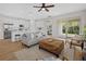 Spacious living room with modern furniture, an open floor plan, and access to outdoor patio at 4390 Asteria Ter, North Port, FL 34287