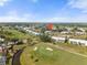Aerial view showcasing the community and golf course at 458 Cerromar Rd # 382, Venice, FL 34293