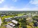 Sprawling community featuring meticulously landscaped grounds, golf course, and condo buildings at 458 Cerromar Rd # 382, Venice, FL 34293