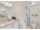 Well-maintained bathroom with a sink, shower, and white cabinets, providing a clean and functional space at 458 Cerromar Rd # 382, Venice, FL 34293