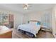 Bright bedroom boasts wood floors, sliding door access to lanai, and ample natural light at 458 Cerromar Rd # 382, Venice, FL 34293