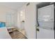 Comfortable bedroom featuring a convenient washer and dryer setup, with easy access to the bathroom at 458 Cerromar Rd # 382, Venice, FL 34293