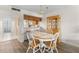 Bright dining area with wood floors and views to the kitchen at 458 Cerromar Rd # 382, Venice, FL 34293