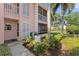 Exterior of the property featuring well-manicured landscaping and a view of the surrounding neighborhood at 458 Cerromar Rd # 382, Venice, FL 34293