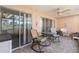 Relaxing covered lanai, perfect for enjoying the outdoors with comfortable seating and a tiled floor at 458 Cerromar Rd # 382, Venice, FL 34293