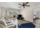 Spacious living room with wood flooring and sliding glass doors leading to an outdoor patio at 458 Cerromar Rd # 382, Venice, FL 34293