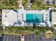 Aerial view of a community pool with lounge chairs at 458 Cerromar Rd # 382, Venice, FL 34293
