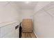 Spacious walk-in closet with shelves, drawers, and a wooden dresser for organized storage at 458 Cerromar Rd # 382, Venice, FL 34293