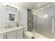 Modern bathroom with a glass-enclosed shower, sleek vanity, and updated fixtures at 4616 Leeta Ln, Sarasota, FL 34234