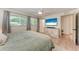 This bedroom has natural lighting from the windows and television entertainment set at 4616 Leeta Ln, Sarasota, FL 34234