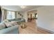Open-concept living and dining space with hardwood floors, neutral walls, and modern decor at 4616 Leeta Ln, Sarasota, FL 34234